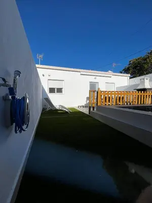 a fire hydrant on the side of a building at Alojamiento rural colarte in Conil de la Frontera