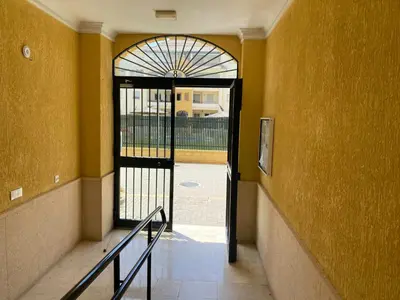an empty hallway with a door to a hallwayngthngthngthngthngthngthngth at Apartamento La Laguna in Chipiona