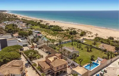 an aerial view of a house and the beach at Stunning Home In Chiclana De La Fronter in Novo Sancti Petri