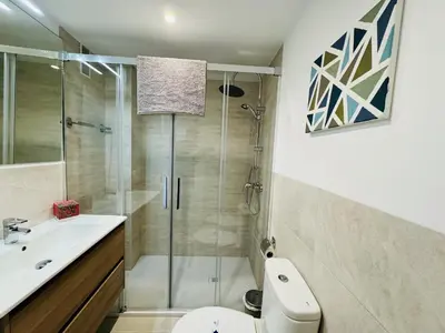 a bathroom with a shower and a toilet and a sink at El Vigia Grupo AC Gestion in Vista Hermosa