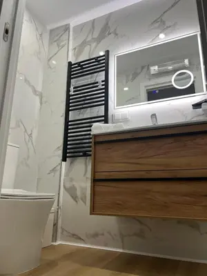 a bathroom with a sink and a mirror at Habitaciones Castillo Deluxe in Sanlúcar de Barrameda
