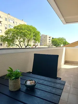 a bowl of food on a table on a balcony at Luminoso Apartamento con Balcón in El Puerto de Santa María