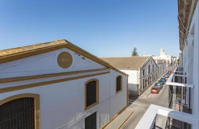 a view of a street from a balcony of a building at Luminoso y acogedor apartamento en el centro in El Puerto de Santa María