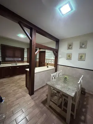a kitchen with a table and a bath tub at Sun and relaxation Book your paradise in Chiclana de la Frontera