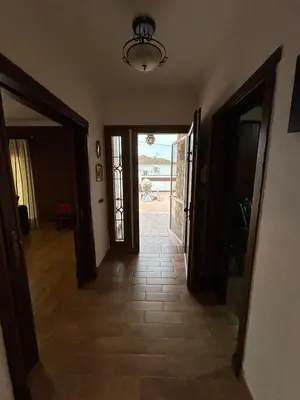 a hallway with an open door to a room with a view at Sun and relaxation Book your paradise in Chiclana de la Frontera
