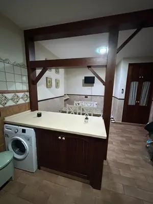 a kitchen with a washing machine and a washer at Sun and relaxation Book your paradise in Chiclana de la Frontera