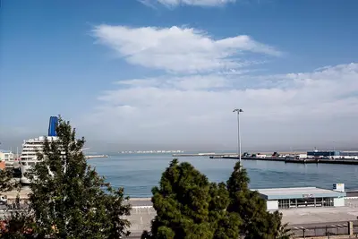 a large body of water with trees and a pier at Apartamento Vistabella in Cádiz