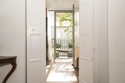 a hallway with a door leading to a patio at Luxe Madre de Dios in Sanlúcar de Barrameda