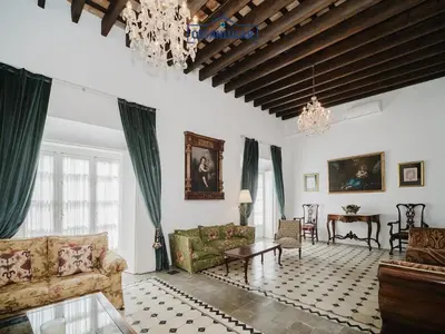 a living room with a couch and a table at Casa Puerto Lucero in Sanlúcar de Barrameda
