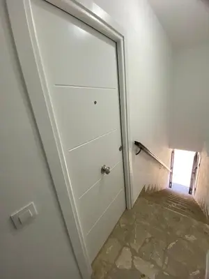 a door in a room with a tile floor at Casa Mateo in Jedula