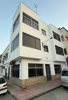 a white building on the side of a street at Casa Mateo in Jedula