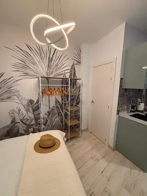 a room with a table with a hat on it at Estudio en Jerez de la Frontera in Jerez de la Frontera