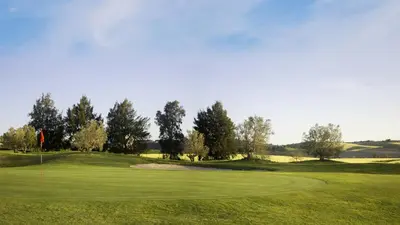 a view of a golf course with a green at Taina Suite La Merced Primero Muro in Jerez de la Frontera