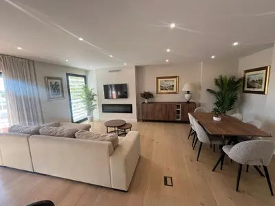 a living room with a couch and a table at Mirador Sanlúcar 10 in Sanlúcar de Barrameda