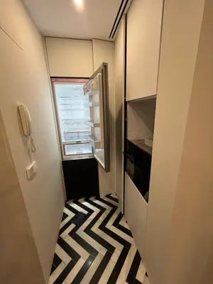 an empty refrigerator with a striped floor in a hallway at Mirador Sanlúcar 10 in Sanlúcar de Barrameda