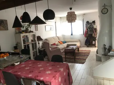 a living room with a couch and a table at Mediterranean house in Bajo Guía in Sanlúcar de Barrameda
