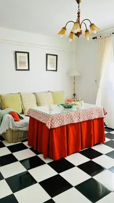 a living room with a table and a couch at Casa Nieves, totalmente equipada Planta 2 in Arcos de la Frontera