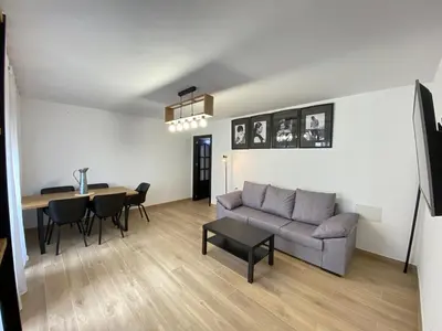 a living room with a couch and a table at Apartmento Carmen Viejo, Centro in Sanlúcar de Barrameda