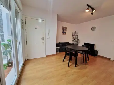 a dining room with a table and a living room at CDZ - San Telmo in Cádiz