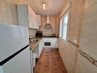 a small kitchen with a sink and a refrigerator at CDZ - San Telmo in Cádiz