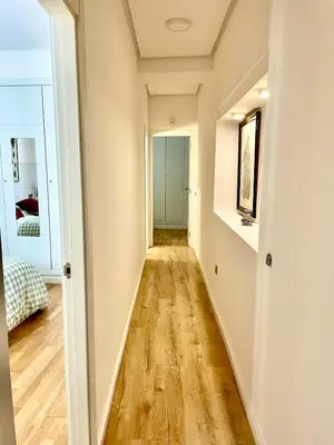 an empty hallway with wood floors in a house at El Buen Porvenir Casa Palacio en Jerez in Jerez de la Frontera