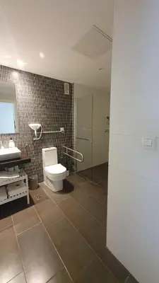 a bathroom with a toilet and a shower and a sink at Apartamento Azalea in El Puerto de Santa María