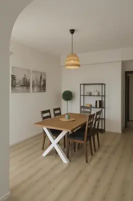 a dining room with a wooden table and chairs at cls in El Puerto de Santa María
