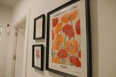 a framed picture of flowers hanging on a wall at Apartamento The River in El Puerto de Santa María