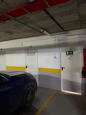 a parking garage with a car parked in it at Charming house Costa Ballena in Rota