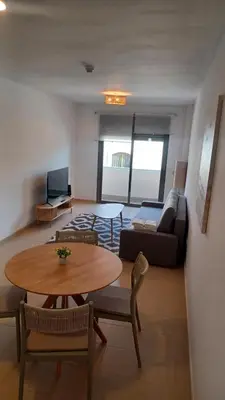 a living room with a table and a couch at Apartamento Nuevo Céntrico El Puerto de Santa María in El Puerto de Santa María