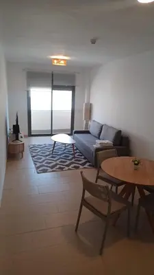 a living room with a couch and a table at Apartamento Nuevo Céntrico El Puerto de Santa María in El Puerto de Santa María