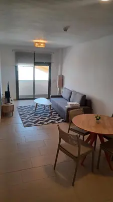 a living room with a couch and a table at Apartamento Nuevo Céntrico El Puerto de Santa María in El Puerto de Santa María