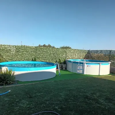 a swimming pool and a boat in a yard at El SITIO DE MI RECREO in El Puerto de Santa María