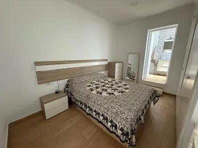 a bedroom with a bed and a window at Sueños de Santiago in Jerez de la Frontera