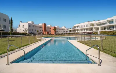 a swimming pool in the middle of a building at Beautiful Apartment In Chipiona in Chipiona