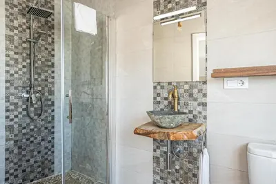 a bathroom with a sink and a shower at MESANA in Chiclana de la Frontera