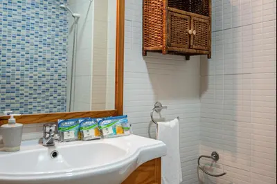a bathroom with a white sink and a mirror at carrajolilla 7B 13 in Chiclana de la Frontera