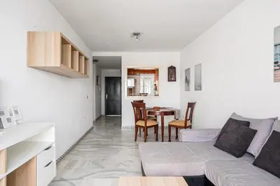 a living room with a couch and a table at Laja Bermeja in Chiclana de la Frontera