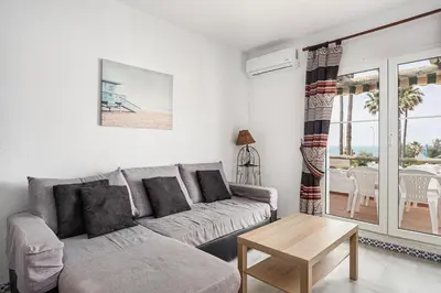 a living room with a couch and a table at Laja Bermeja in Chiclana de la Frontera