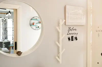 a mirror in a white room with a shelf at Casa Nao Santiago - Sanlúcar de Barrameda - Centro Playa in Sanlúcar de Barrameda