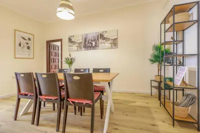 a dining room with a table and chairs at Cadizz Entre Cielo y Mar Centro del Puerto ciudad - ideal empresas, familias y grupos in El Puerto de Santa María