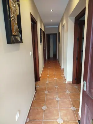 a hallway of a house with a tile floor at Chalet Jones in Chiclana de la Frontera