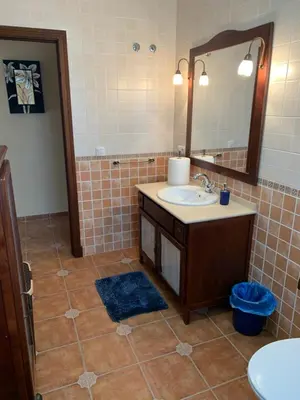 a bathroom with a sink and a mirror at Casa Jones in Chiclana de la Frontera