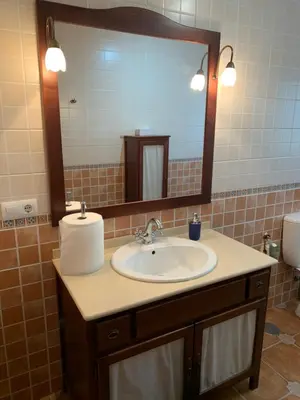 a bathroom with a sink and a mirror at Casa Jones in Chiclana de la Frontera