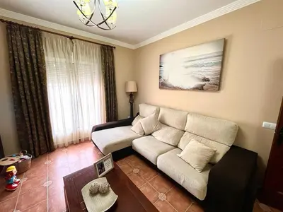 a living room with a couch and a table at Casa Jones in Chiclana de la Frontera