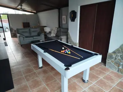 a billiard table in a living room with at Casa Jones in Chiclana de la Frontera