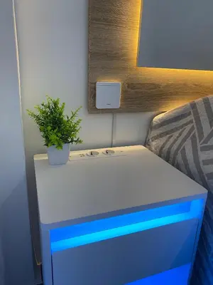 a blue and white dresser with a potted plant on it at Apartamento Las Sirenas in Chipiona