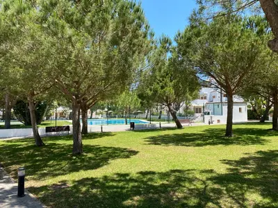a park with trees and a swimming pool at BARROSA CON ENCANTO, AC - WIFI - PARKING, Parejas y familias in Novo Sancti Petri