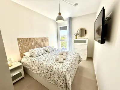 a bedroom with a bed with two teddy bears on it at El rincon de candor by staycare in Rota