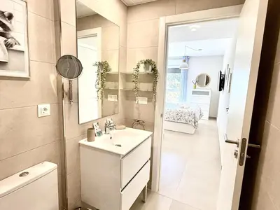 a bathroom with a sink and a mirror at El rincon de candor by staycare in Rota